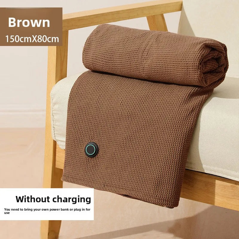 Heated blanket shawl folded for travel or storage