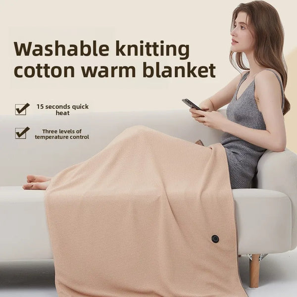 Heated blanket shawl used as a lap cover at a desk